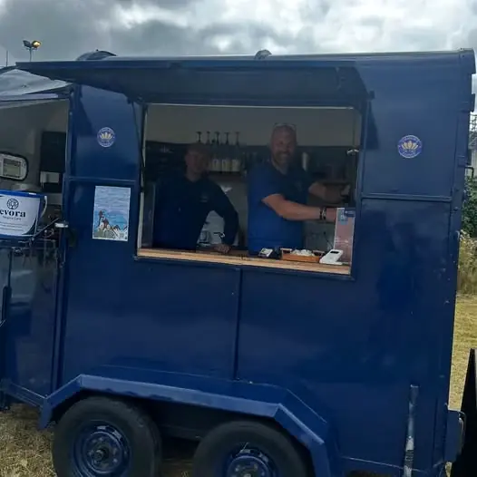 Charlie's Coffee trailer serving at a local football event