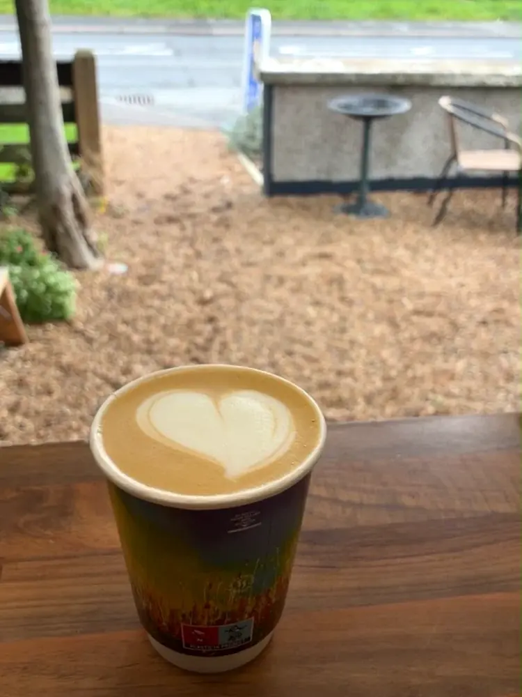 A freshly poured Charlie's coffee enjoyed at an outdoor table