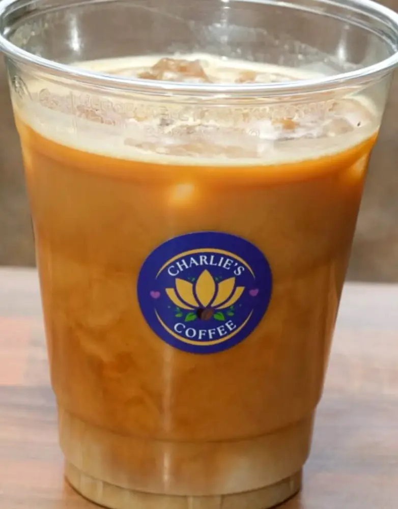 Iced coffee in a Charlie's branded cup