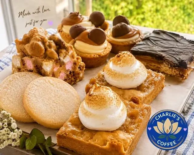 Selection of freshly displayed cakes and sweet treats at Charlie’s Coffee